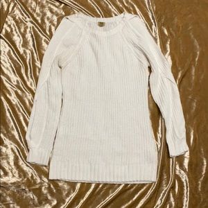 Cream arm cutouts and  lightweight knitted sweater